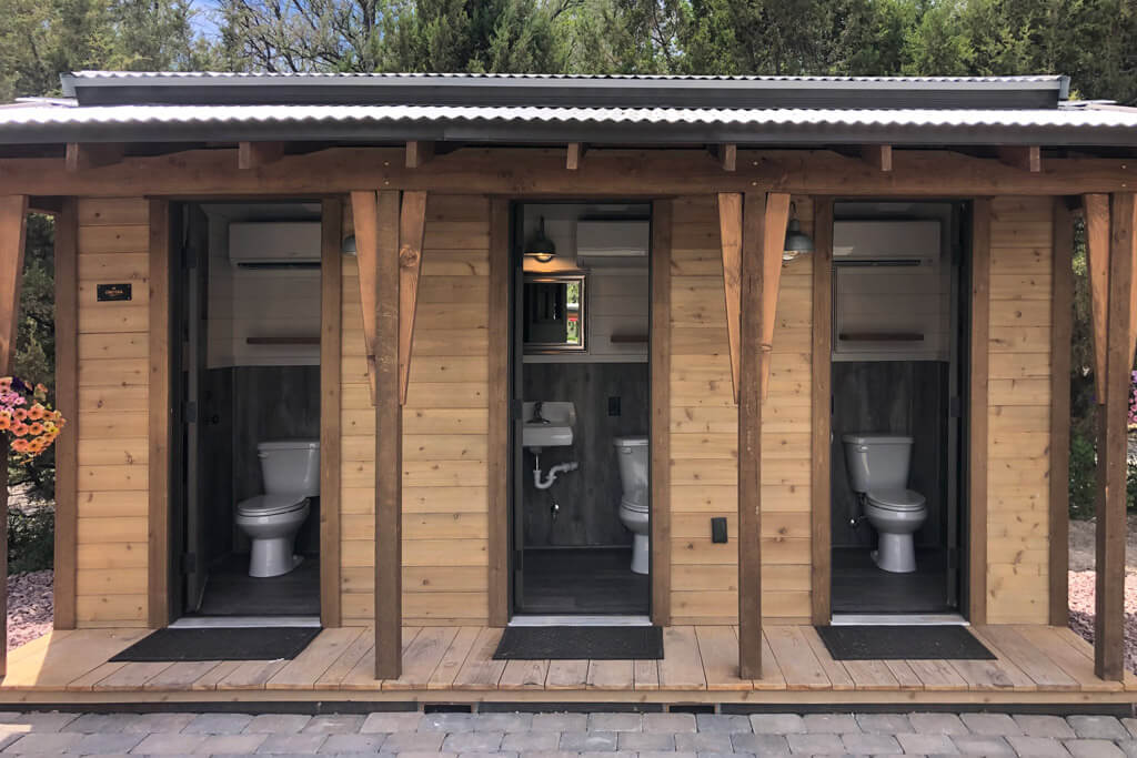 Restroom & Shower Facilities for Your Glamping Site: On-Grid & Off-Grid Solutions